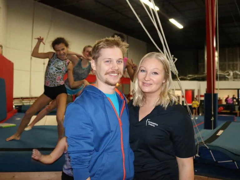 OAA coaches and athlete in the gym
